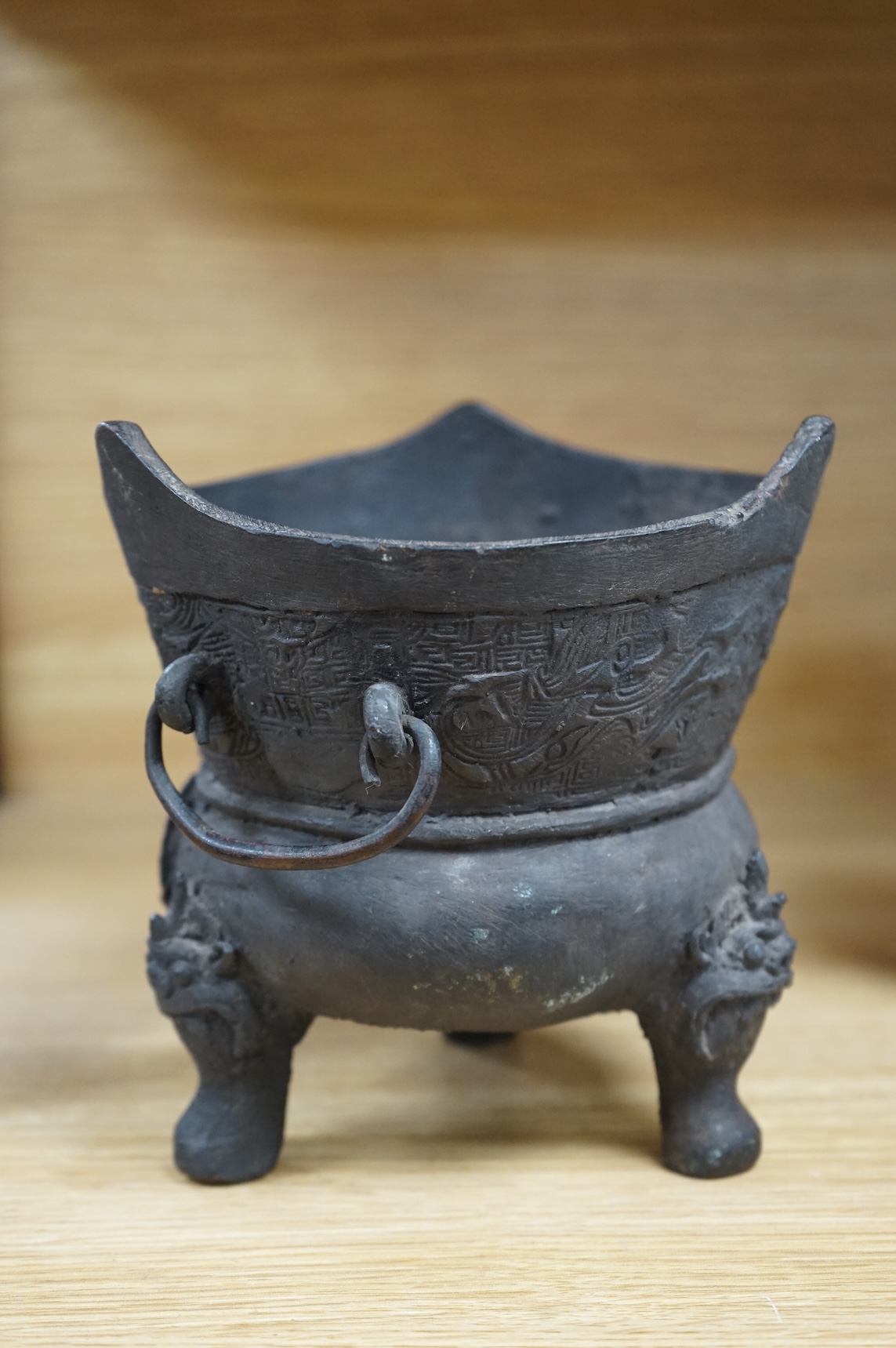 A Chinese or Japanese archaistic bronze censer, 16cm high